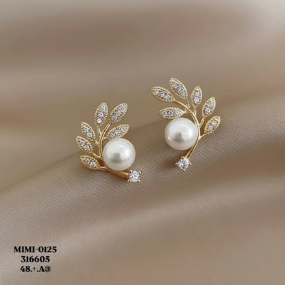 Gilded Pearl Studs — Detail Zoom