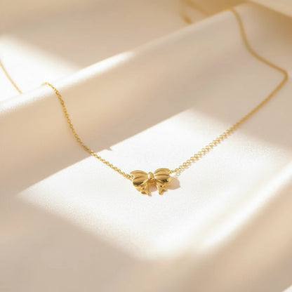 Gold Bow Necklace — Velvet Pedestal