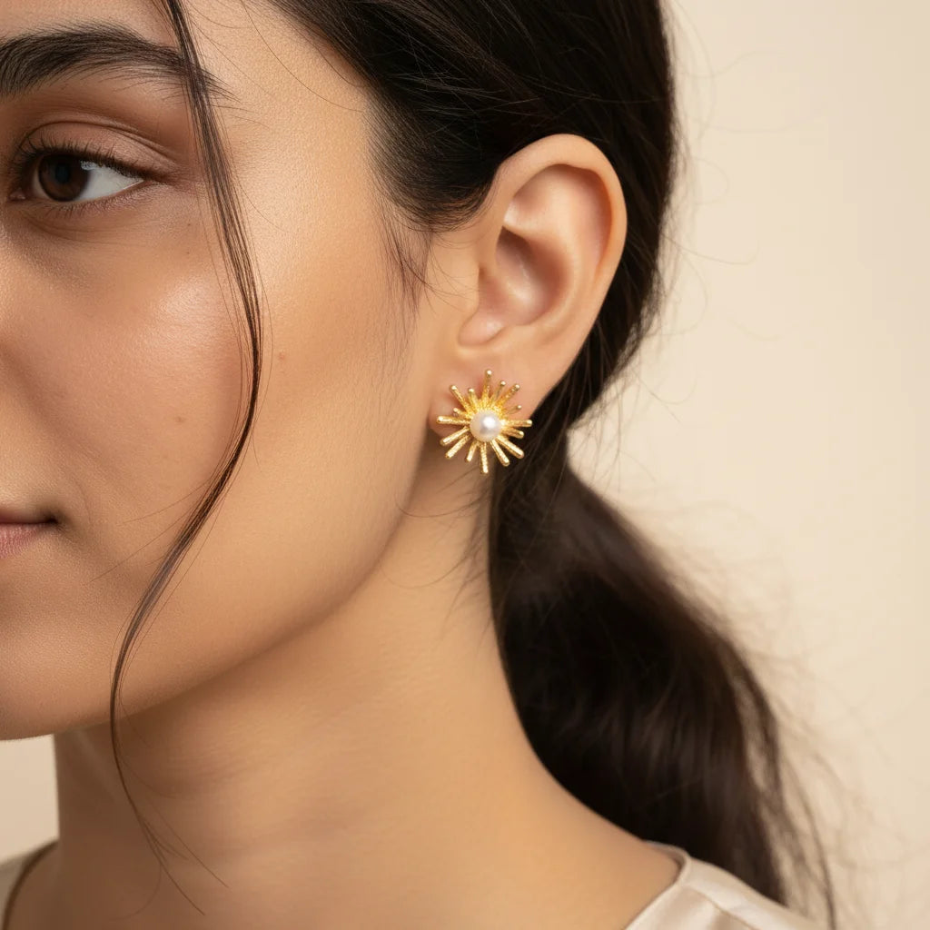 Gold Pearl Starburst Earrings — Worn Close-up