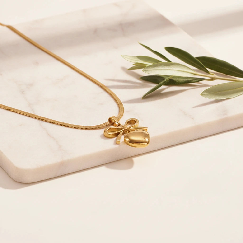 Golden Bow Necklace — Luxe Marble