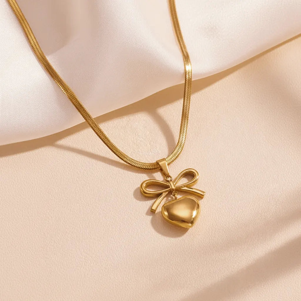 Golden Bow Necklace — Velvet Pedestal