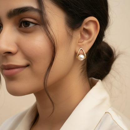 Teardrop Pearl Studs — Worn Close-up