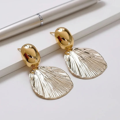 Textured Shell Earrings — Side Angle